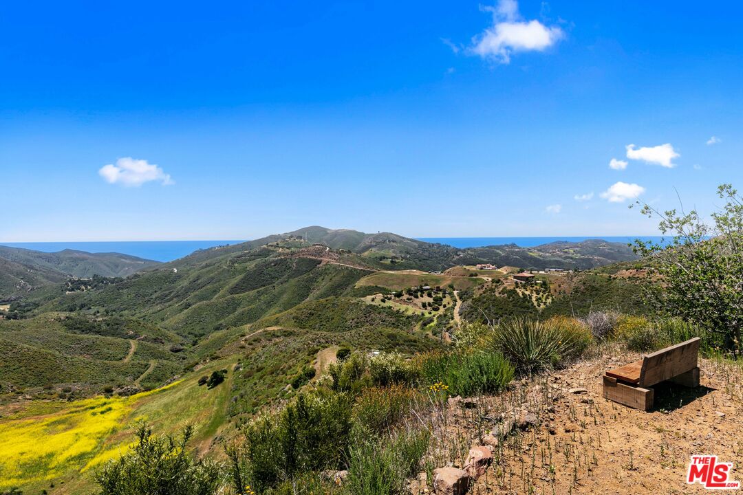 12470 Yerba Buena Road Malibu, CA 90265 - Photo 15 of 17 a view of a lake with a mountain in the background