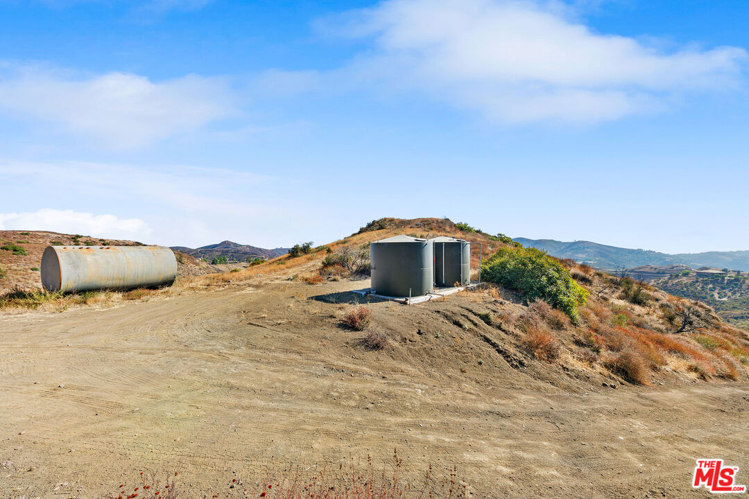 12470 Yerba Buena Road Malibu, CA 90265 - Photo 16 of 17 a front view of a house with a yard