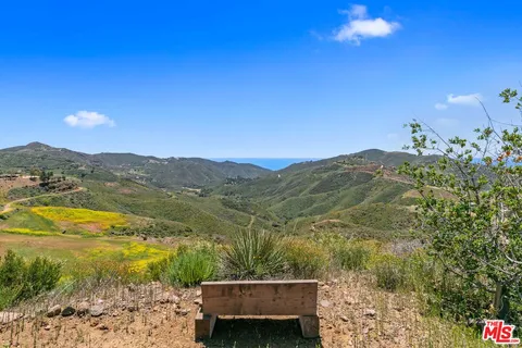 a view of a lake with a mountain in the background