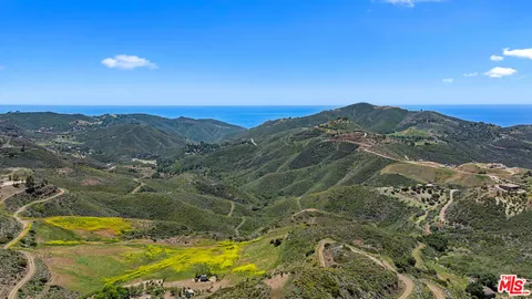 a view of a lake with mountains in the background