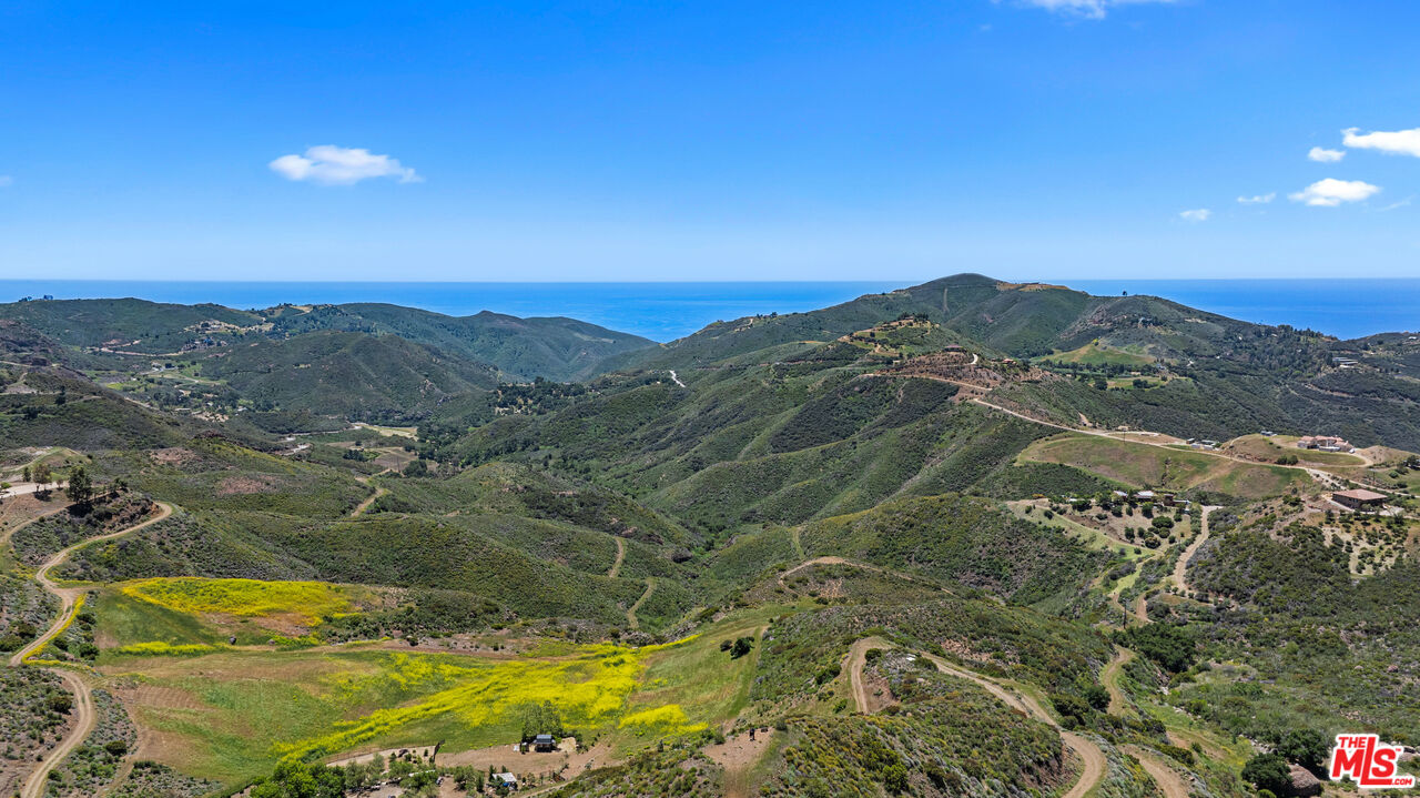 12470 Yerba Buena Road Malibu, CA 90265 - Photo 3 of 17 a view of a lake with mountains in the background