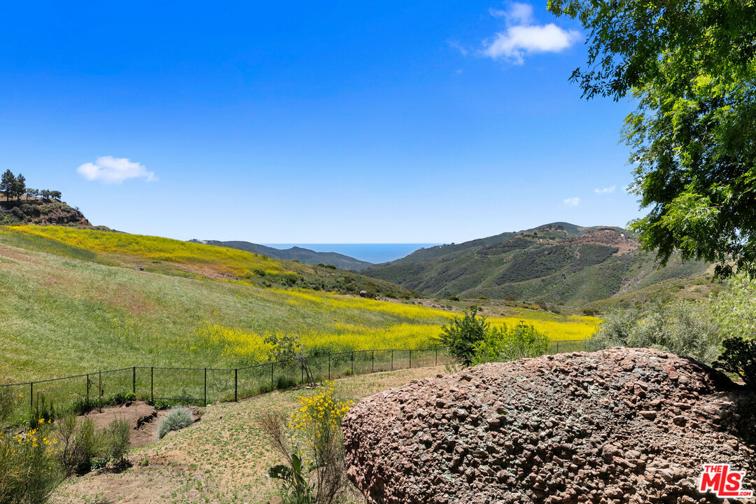 12470 Yerba Buena Road Malibu, CA 90265 - Photo 7 of 17 a view of an ocean and a mountain view