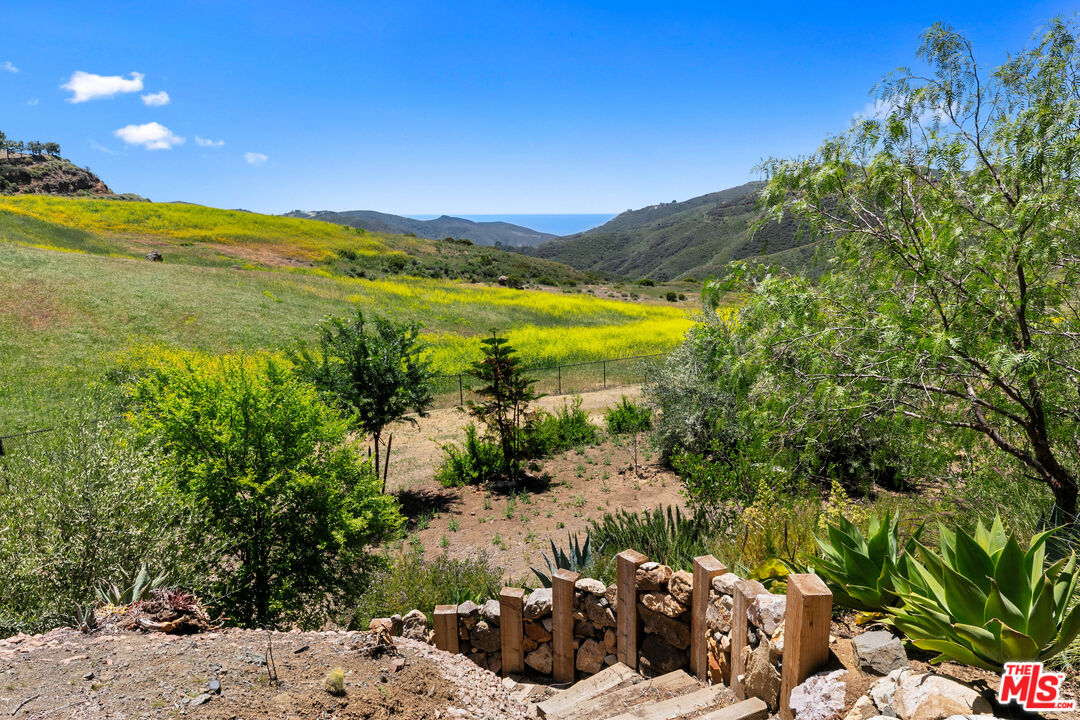 12470 Yerba Buena Road Malibu, CA 90265 - Photo 10 of 17 a view of a lake with a mountain in the background