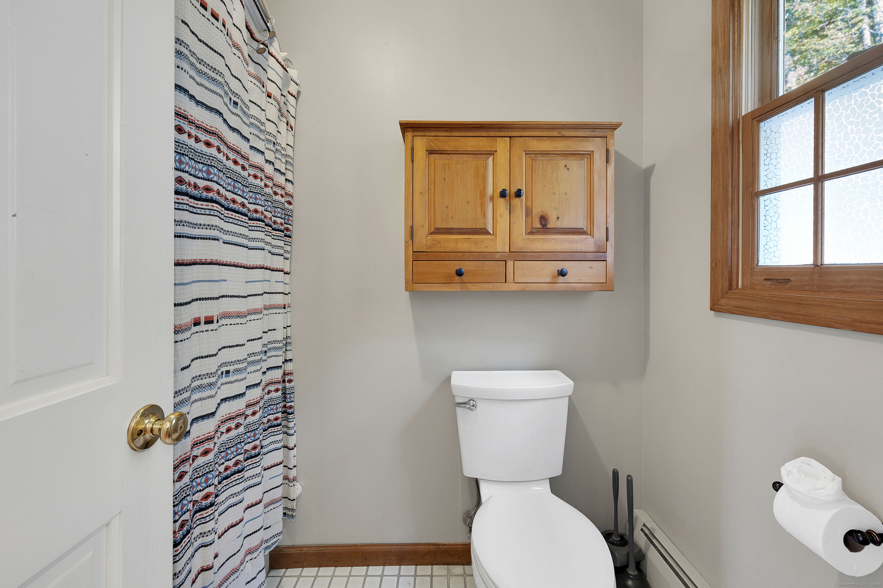 367 Sachem Road Southbury, CT 06488 - Photo 19 of 34 a bathroom with a toilet a sink and mirror