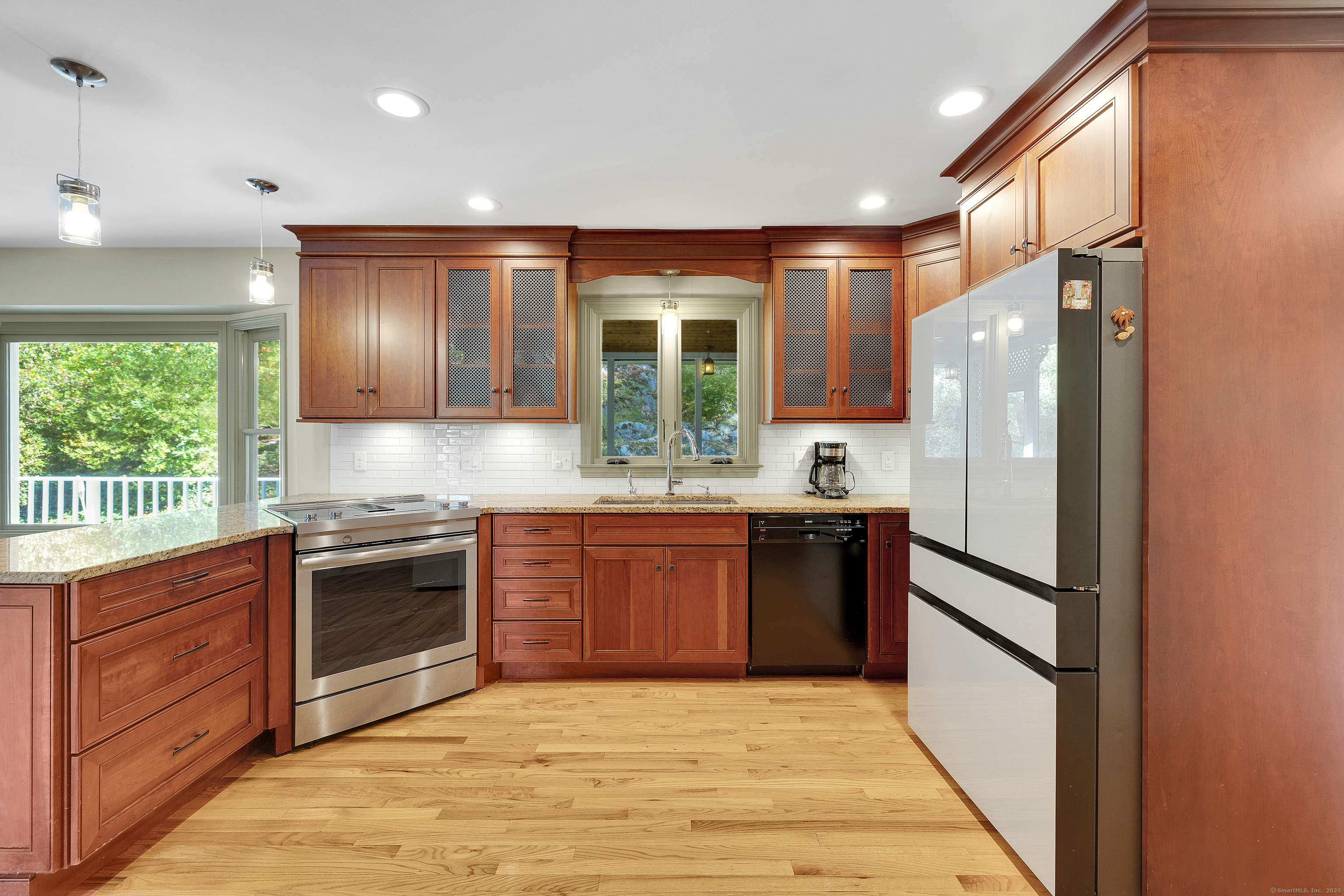 367 Sachem Road Southbury, CT 06488 - Photo 2 of 34 a kitchen with stainless steel appliances granite countertop a refrigerator sink and stove