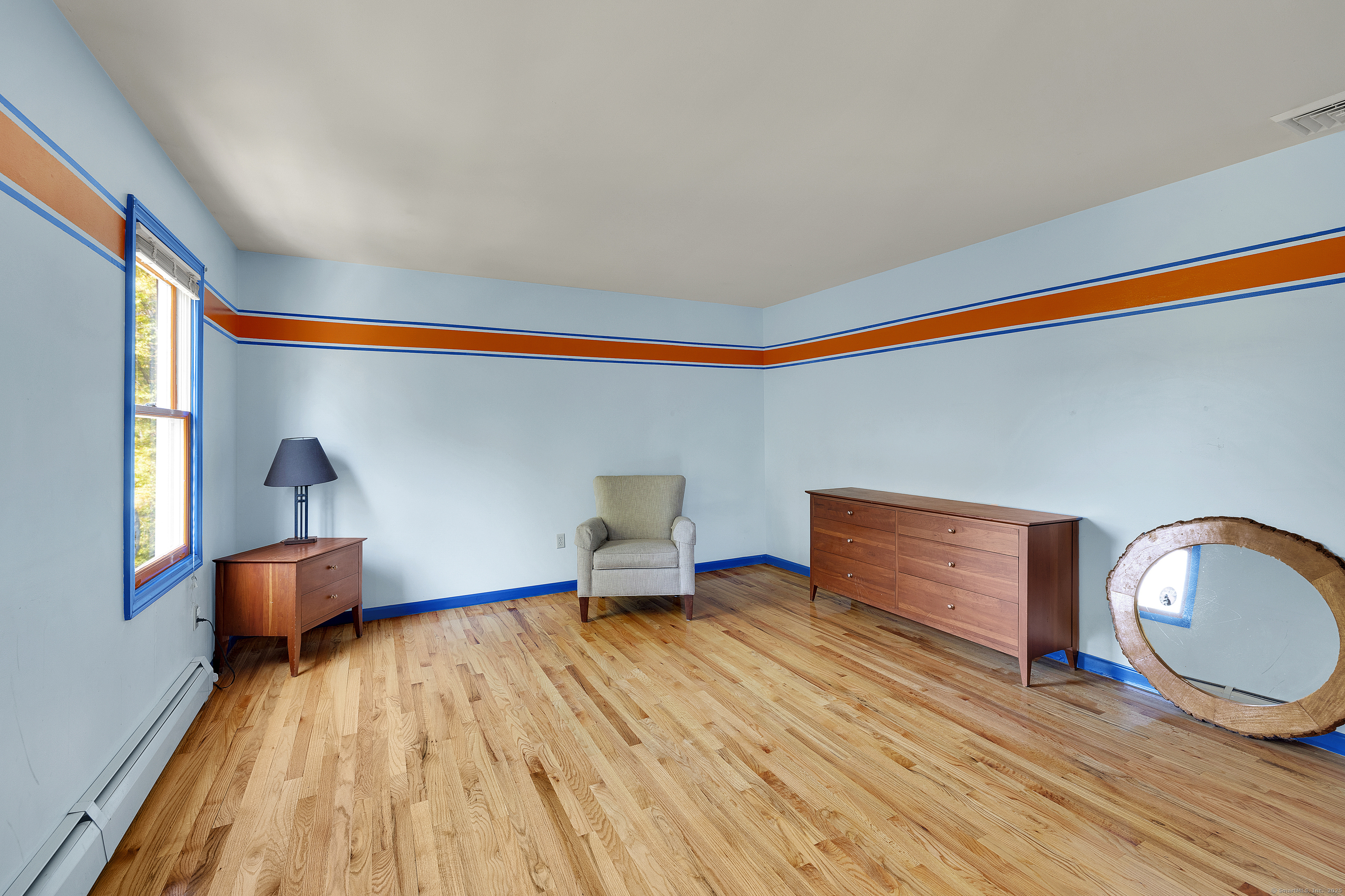 367 Sachem Road Southbury, CT 06488 - Photo 21 of 34 a living room with furniture and a wooden floor