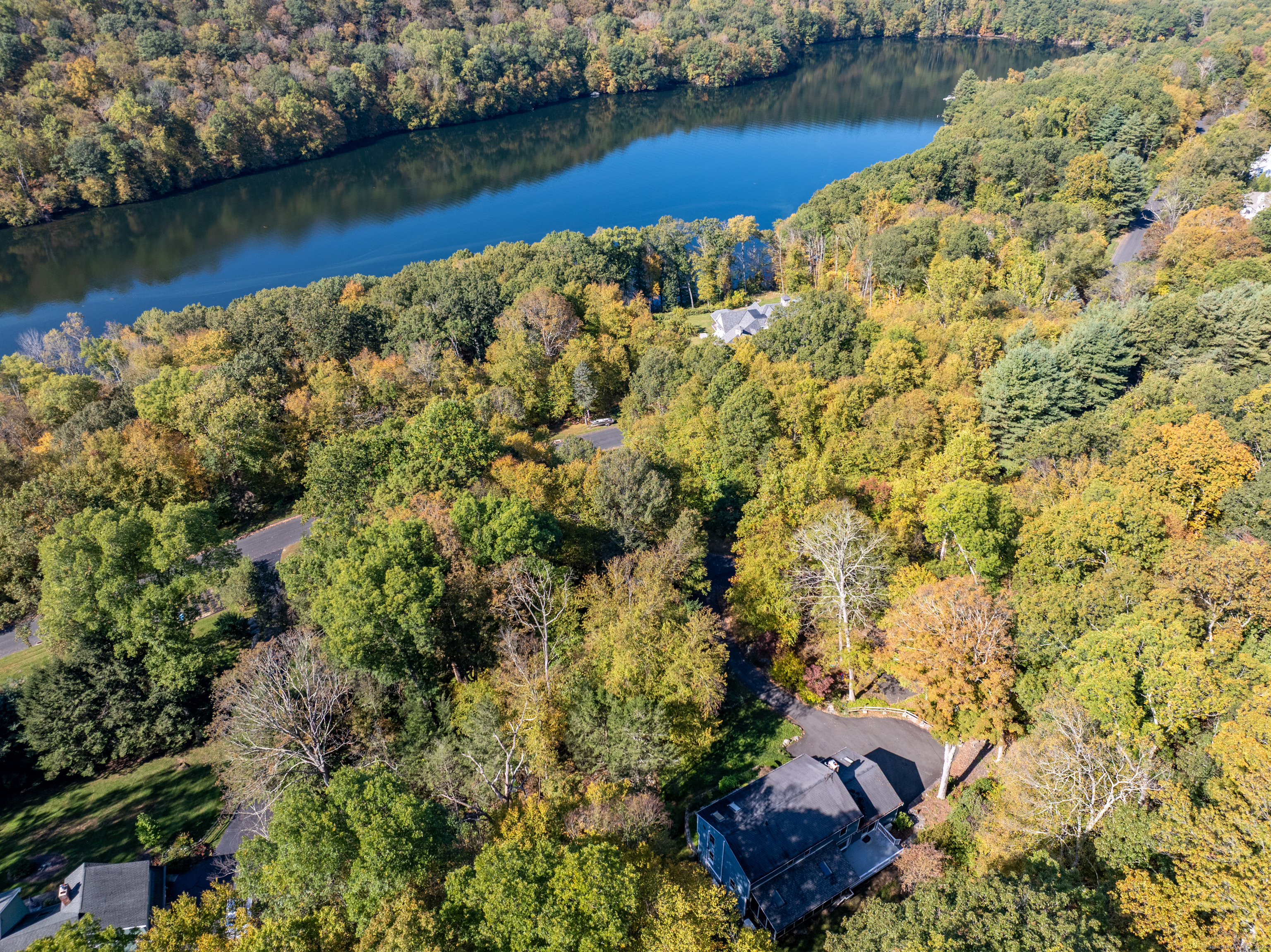 367 Sachem Road Southbury, CT 06488 - Photo 31 of 34 an aerial view of a house with a yard and lake view