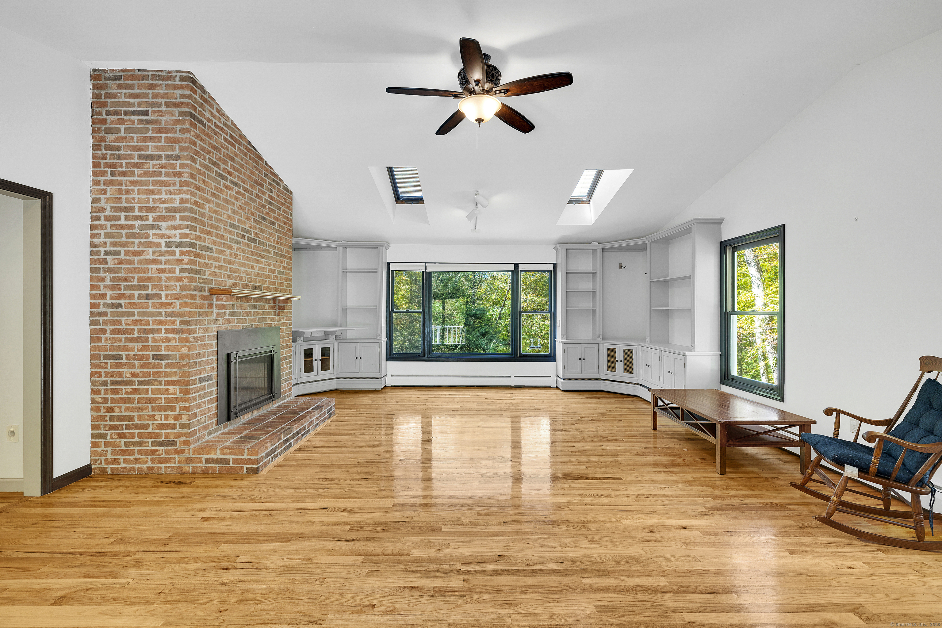 367 Sachem Road Southbury, CT 06488 - Photo 8 of 34 a view of a livingroom with furniture window and wooden floor