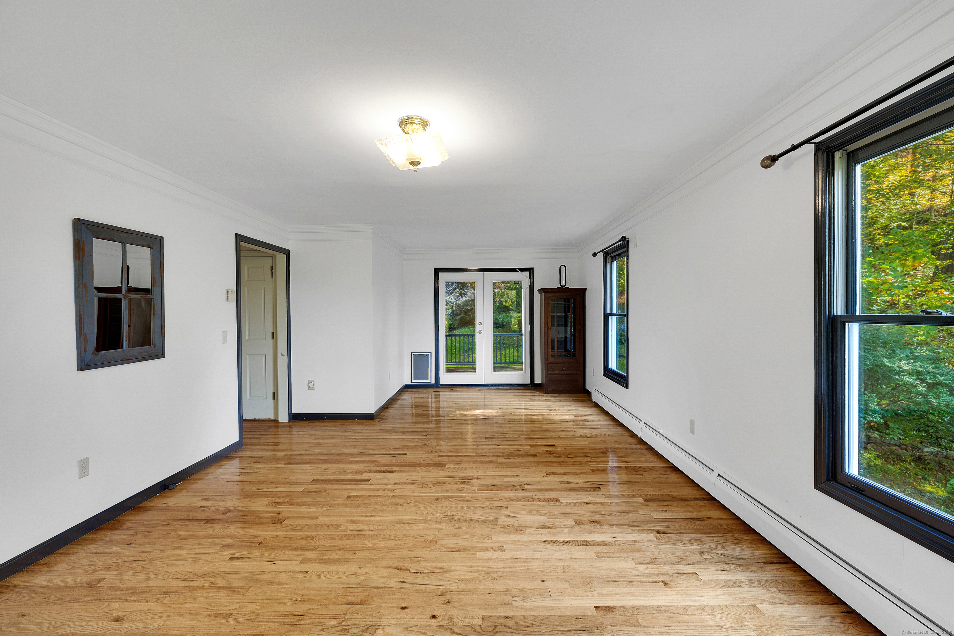 367 Sachem Road Southbury, CT 06488 - Photo 10 of 34 a view of an empty room with glass door