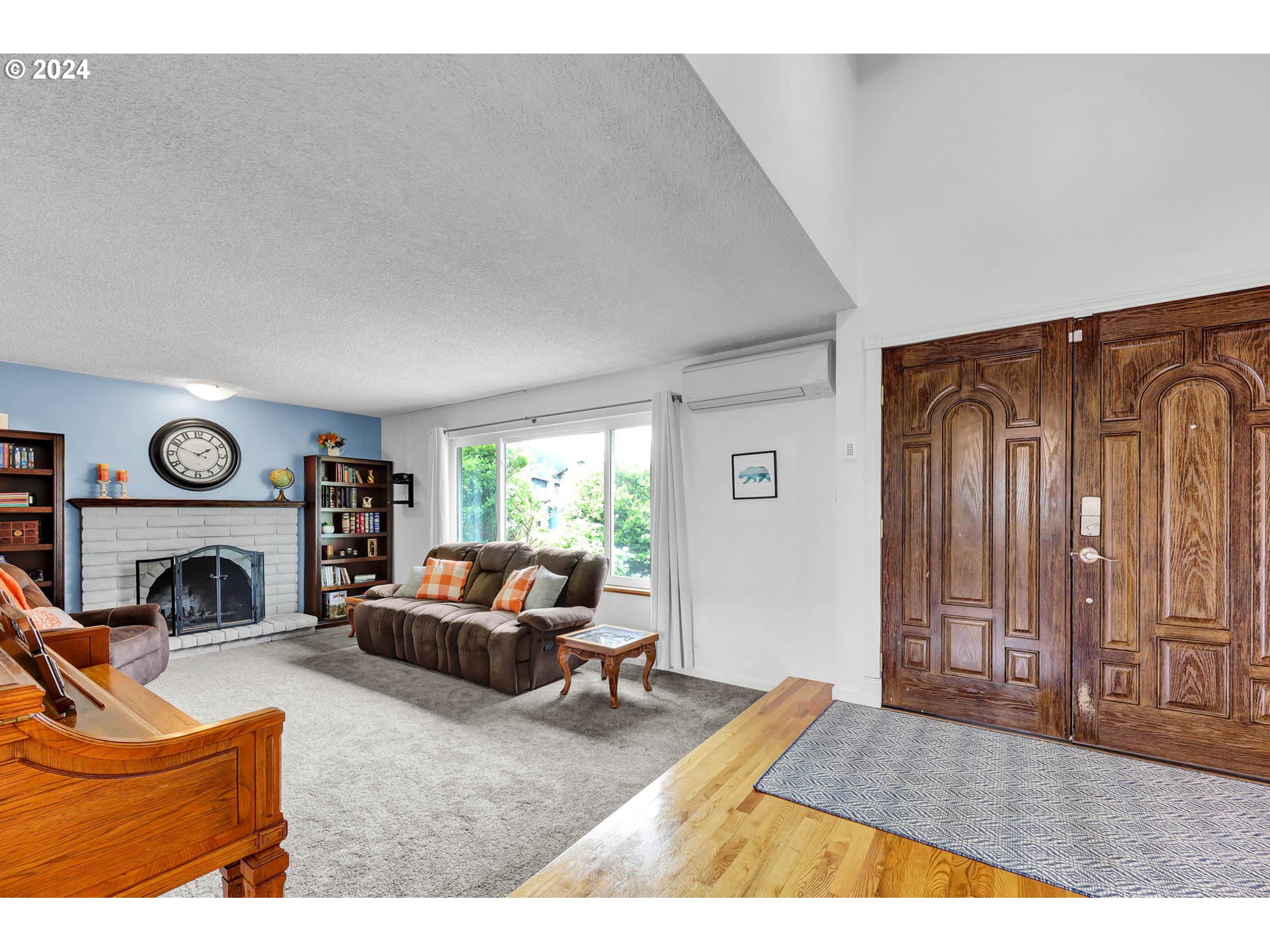 681 71st Street Springfield, OR 97478 - Photo 7 of 44 a living room with furniture a fireplace and a floor to ceiling window