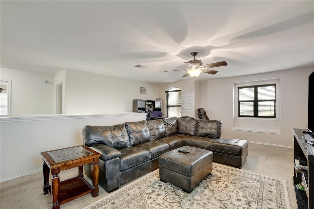 356 Matthews Kyle, TX 78640 - Photo 7 of 30 A spacious and comfortable living area, ideal for relaxation and casual gatherings.
