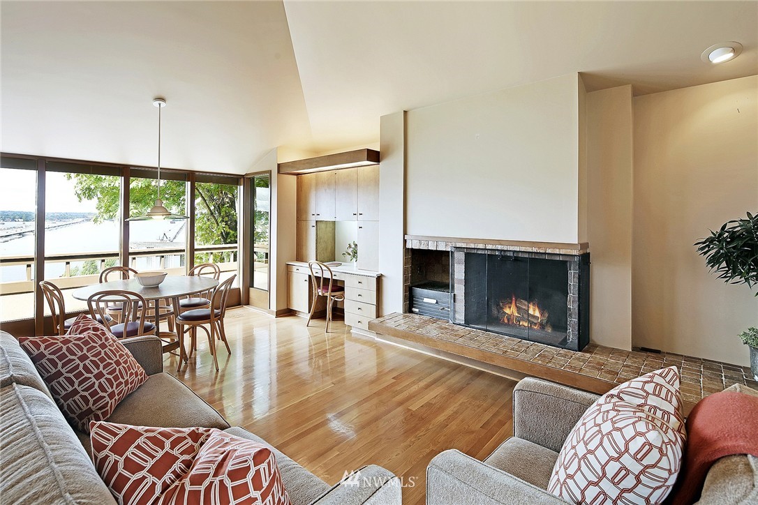 3223 Evergreen Point Road Medina, WA 98039 - Photo 12 of 25 a living room with furniture fireplace and a large window