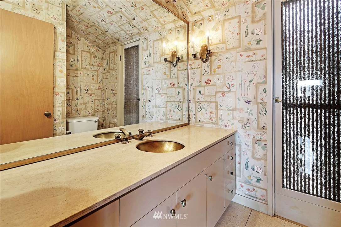 3223 Evergreen Point Road Medina, WA 98039 - Photo 16 of 25 a bathroom with a granite countertop sink and a mirror