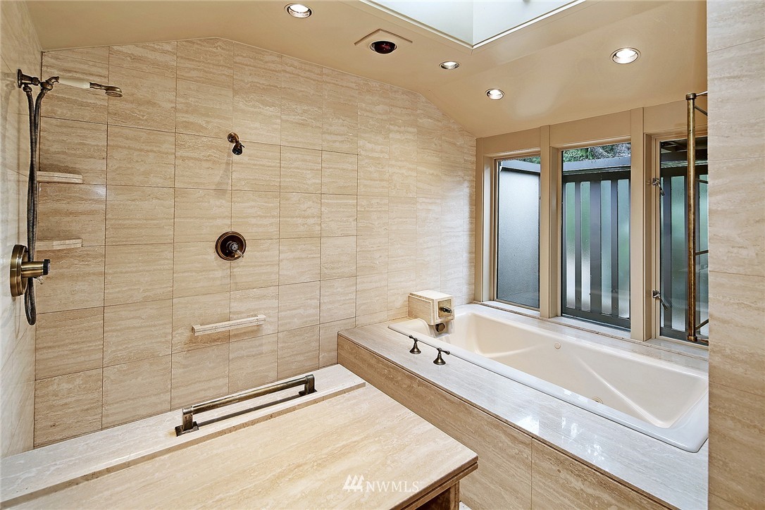 3223 Evergreen Point Road Medina, WA 98039 - Photo 20 of 25 a bathroom with a tub and a sink