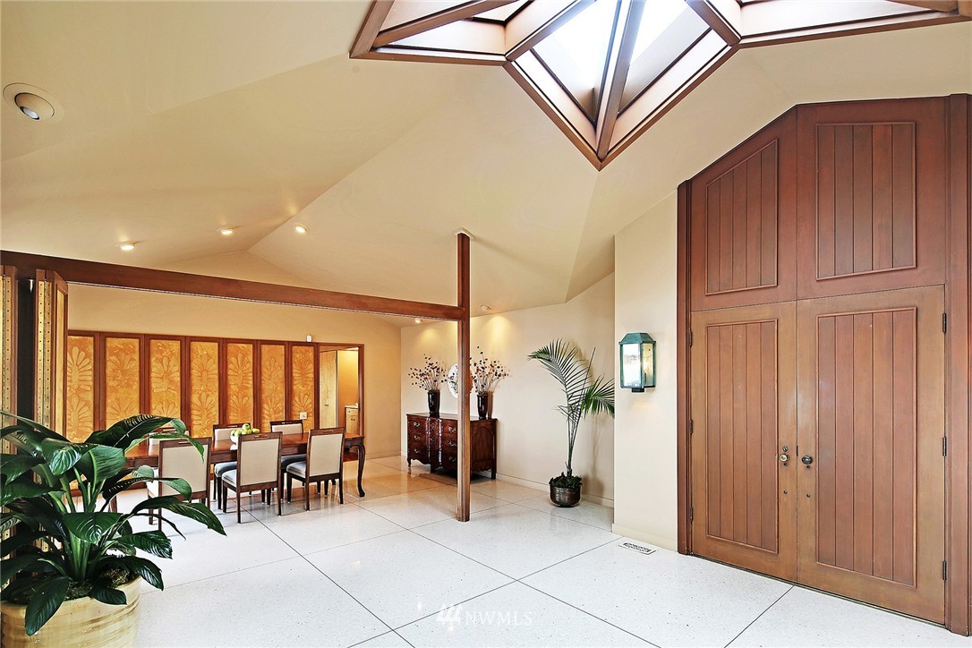 3223 Evergreen Point Road Medina, WA 98039 - Photo 5 of 25 a view of a hallway with furniture and a potted plant