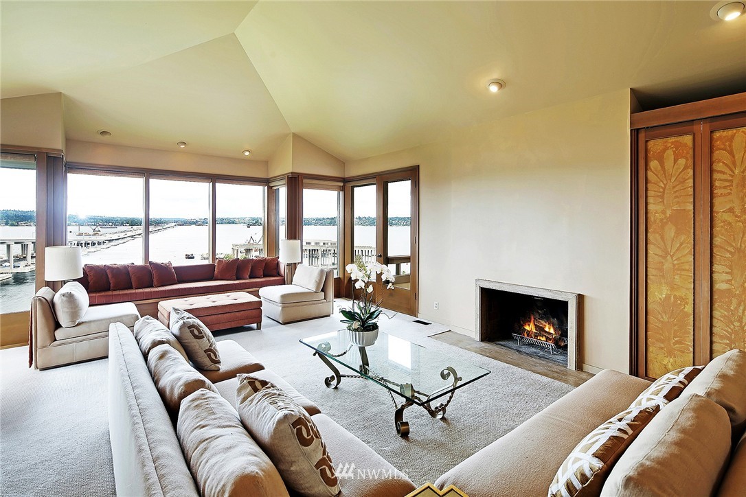 3223 Evergreen Point Road Medina, WA 98039 - Photo 9 of 25 a living room with furniture fireplace and a large window