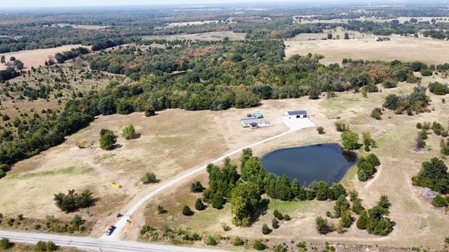 36469 1330th Road Wewoka, OK 74884 - Photo 8 of 39 Expansive property featuring a private pond, open fields, and mature tree lines