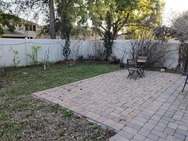 a bench sitting in middle of a yard