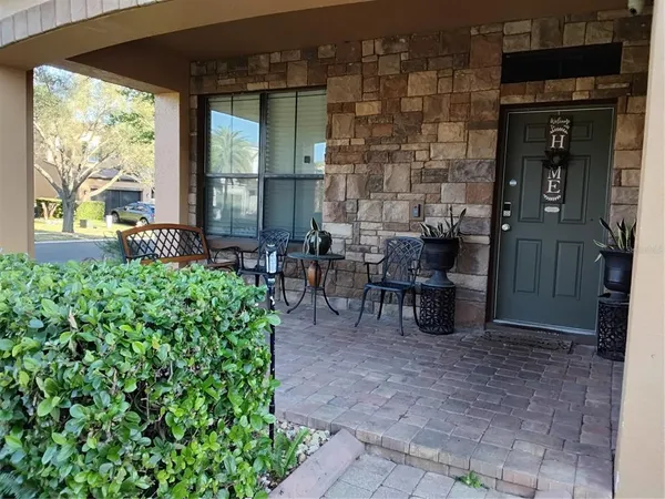 a couple of table and chairs in the patio