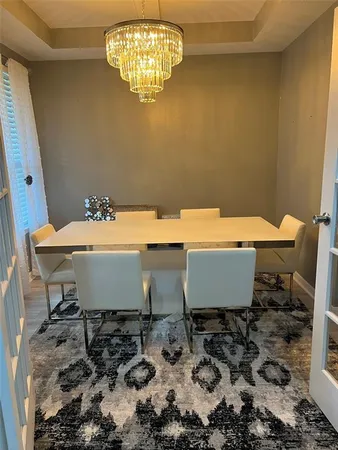 a table and chairs in a blue room