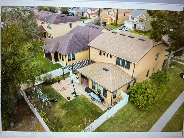 an aerial view of a house with a garden