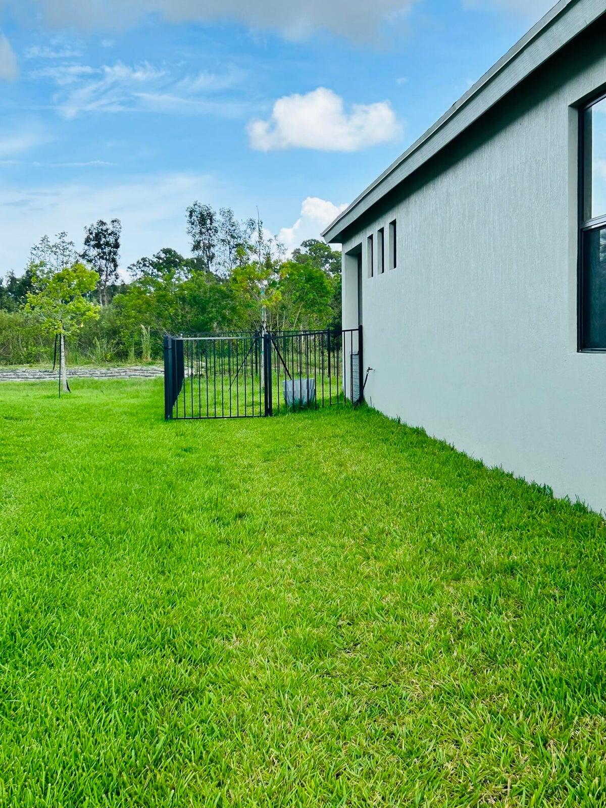 5946 Southeast Sky Blue Circle Stuart, FL 34997 - Photo 24 of 26 fenced backyard.3