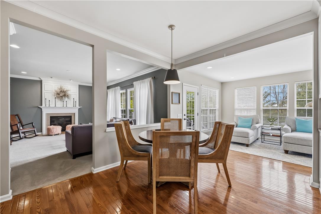 9031 Pathfinder Road Breinigsville, PA 18031 - Photo 16 of 63 Rich hardwood floors welcome guests into this open-concept home, offering a seamless flow between entertaining spaces.
