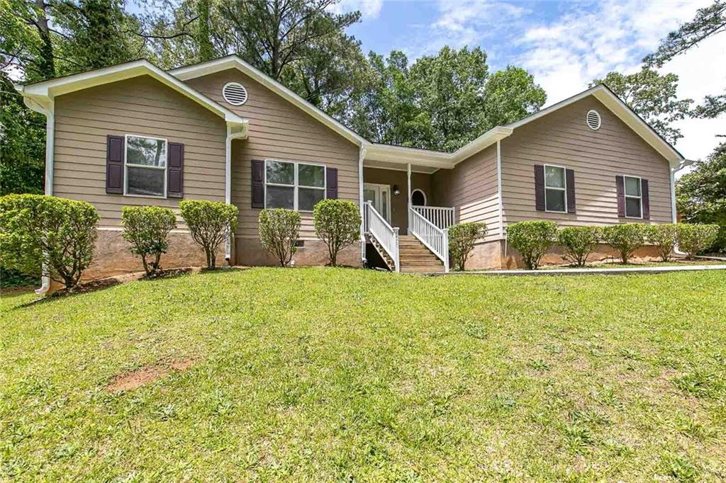 4476 Greenleaf Circle Southwest Atlanta, GA 30331 - Photo 1 of 1 a view of a house with backyard and sitting area