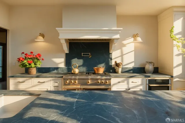 a aerial view of a multi story residential apartment building with a yard