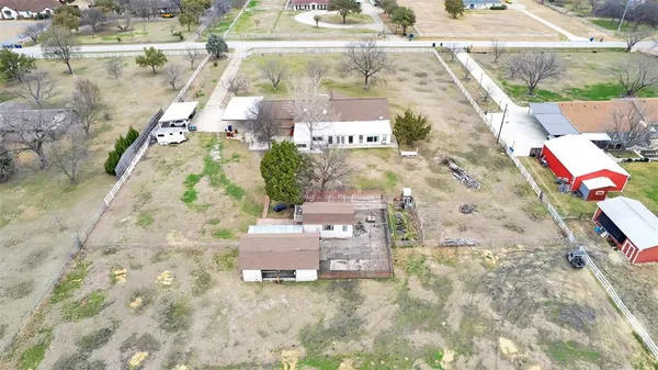 a aerial view of a house with a yard
