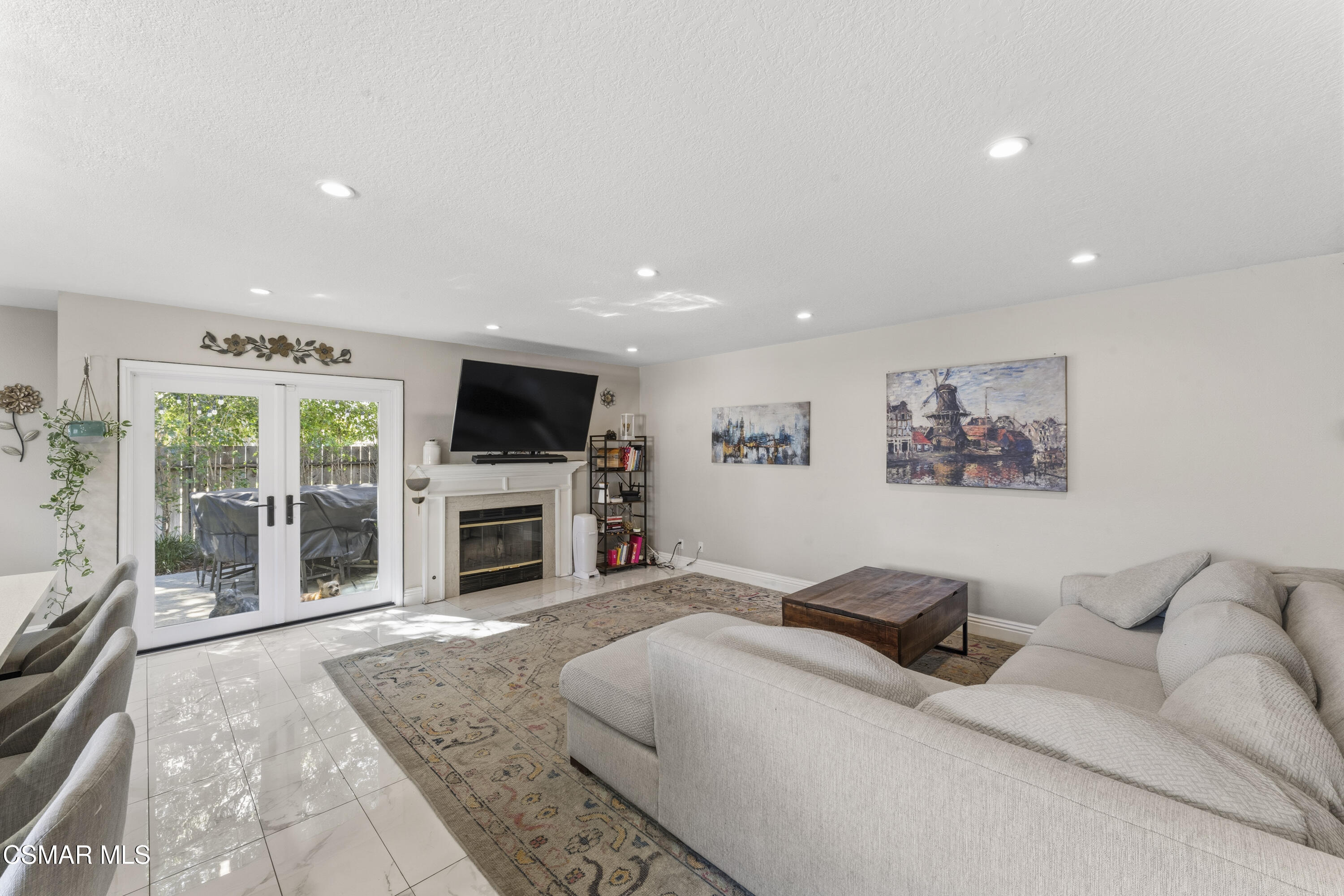 5775 Cochran Street Simi Valley, CA 93063 - Photo 12 of 33 a spacious bedroom with a large bed and a fireplace