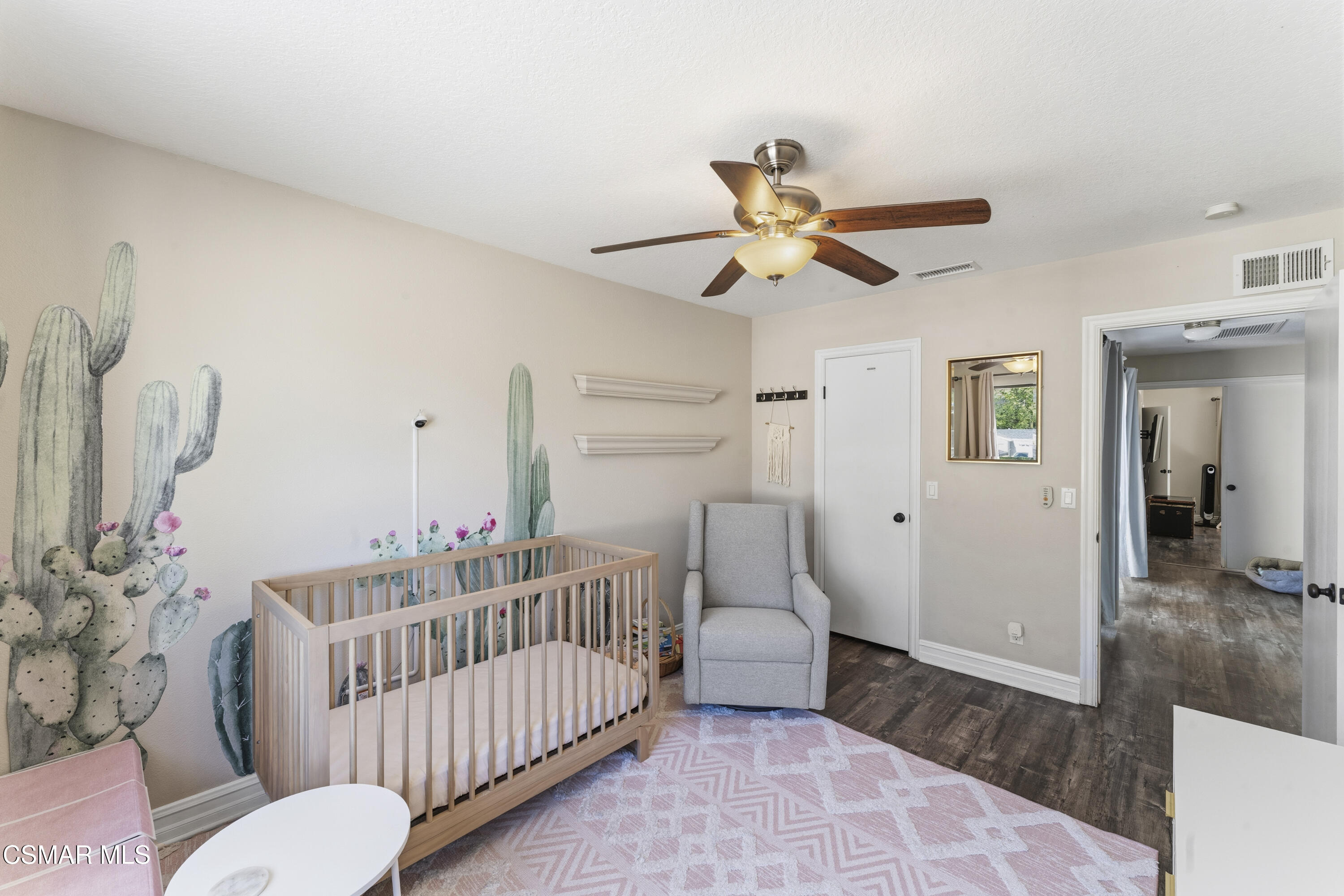 5775 Cochran Street Simi Valley, CA 93063 - Photo 14 of 33 a bedroom with furniture and a wooden floor