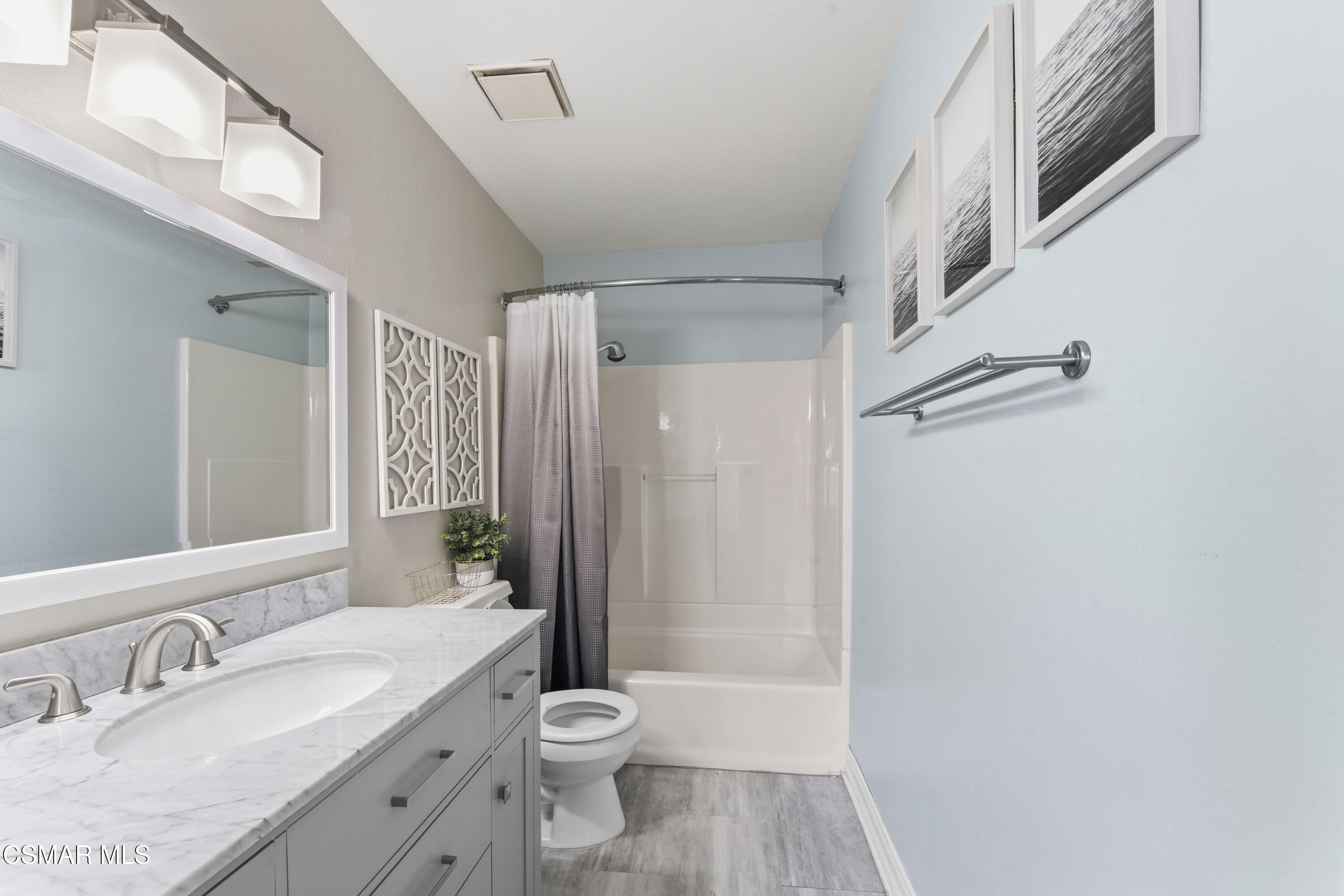 5775 Cochran Street Simi Valley, CA 93063 - Photo 18 of 33 a bathroom with a granite countertop sink toilet and shower
