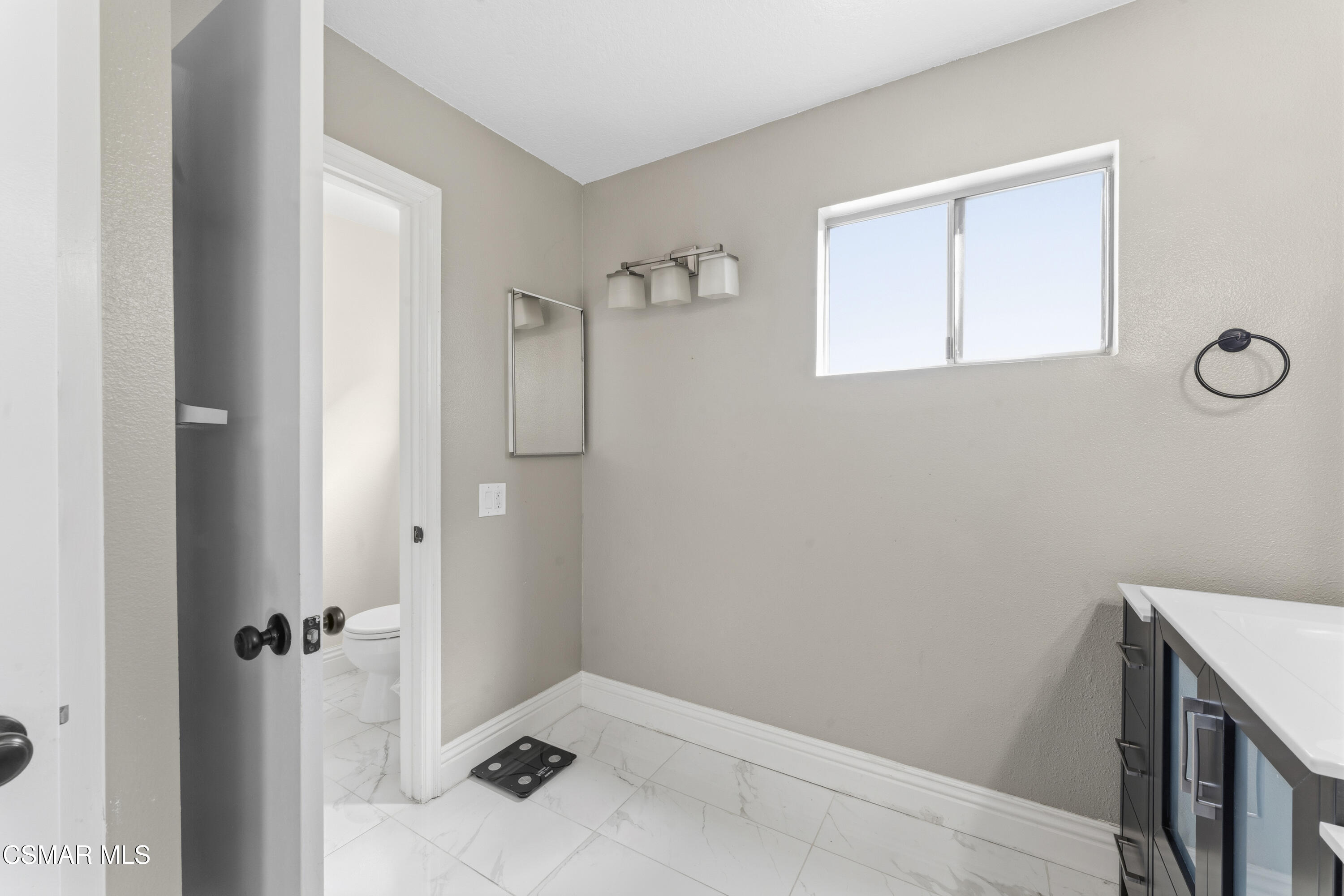 5775 Cochran Street Simi Valley, CA 93063 - Photo 21 of 33 a bathroom with a sink and vanity