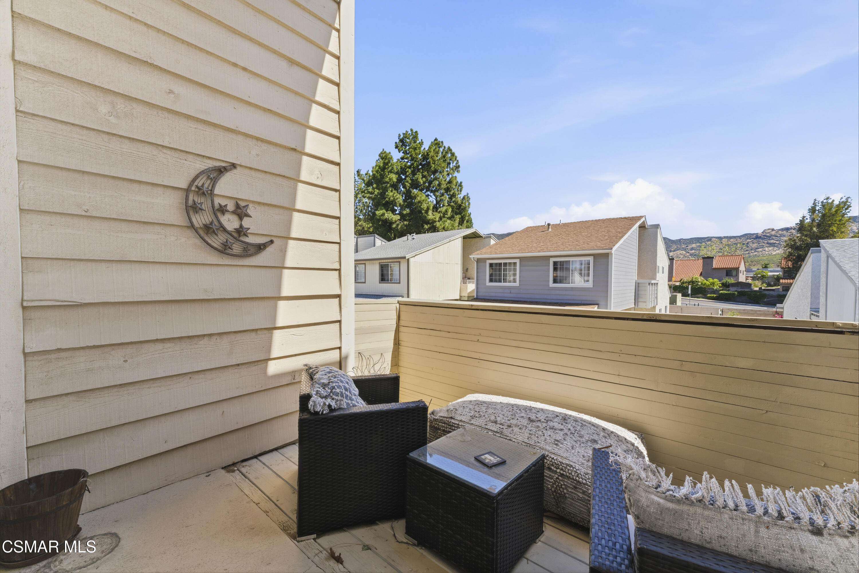 5775 Cochran Street Simi Valley, CA 93063 - Photo 24 of 33 a view of a chair and table in the balcony