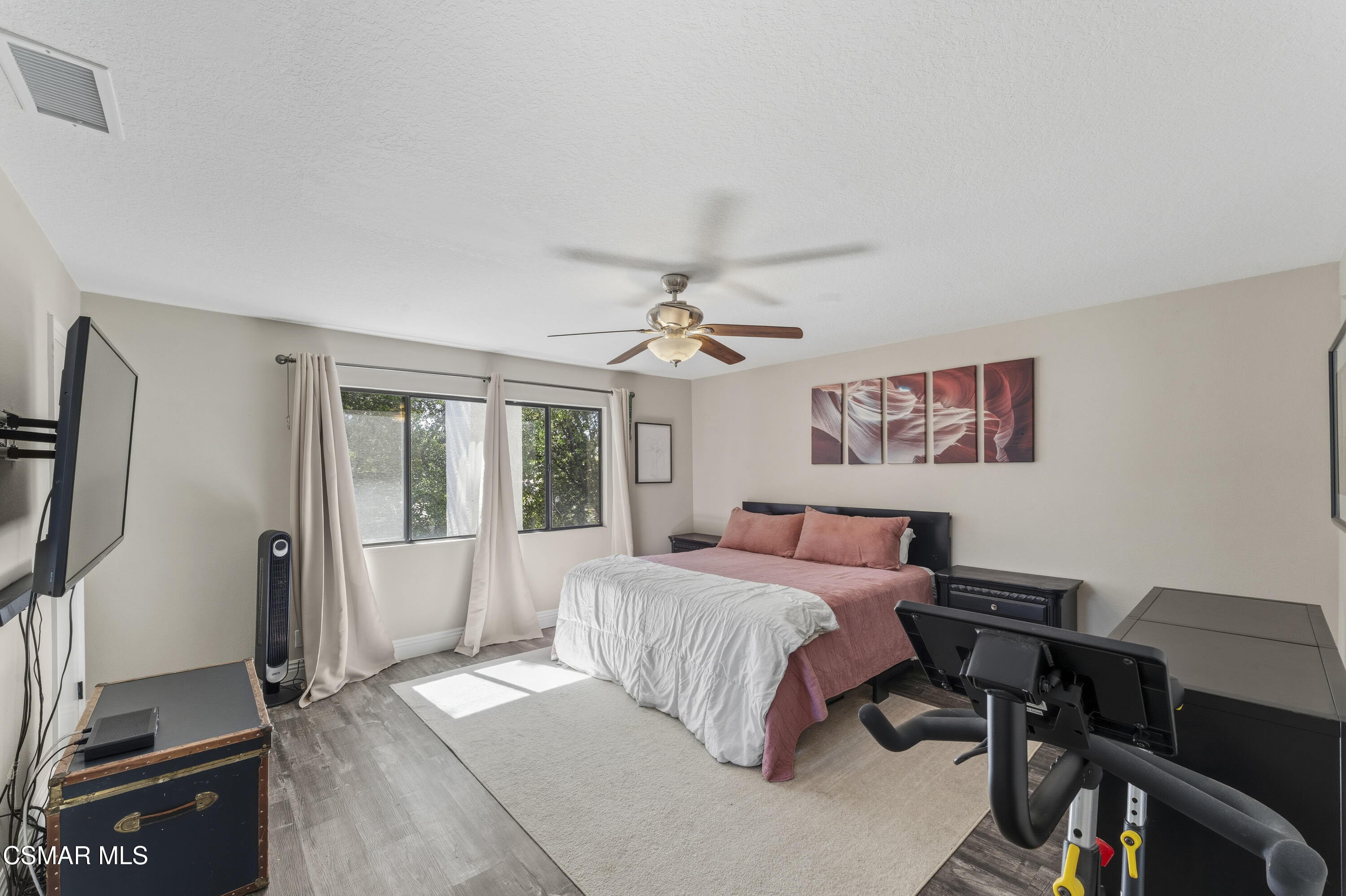 5775 Cochran Street Simi Valley, CA 93063 - Photo 25 of 33 a bedroom with a bed and a desk