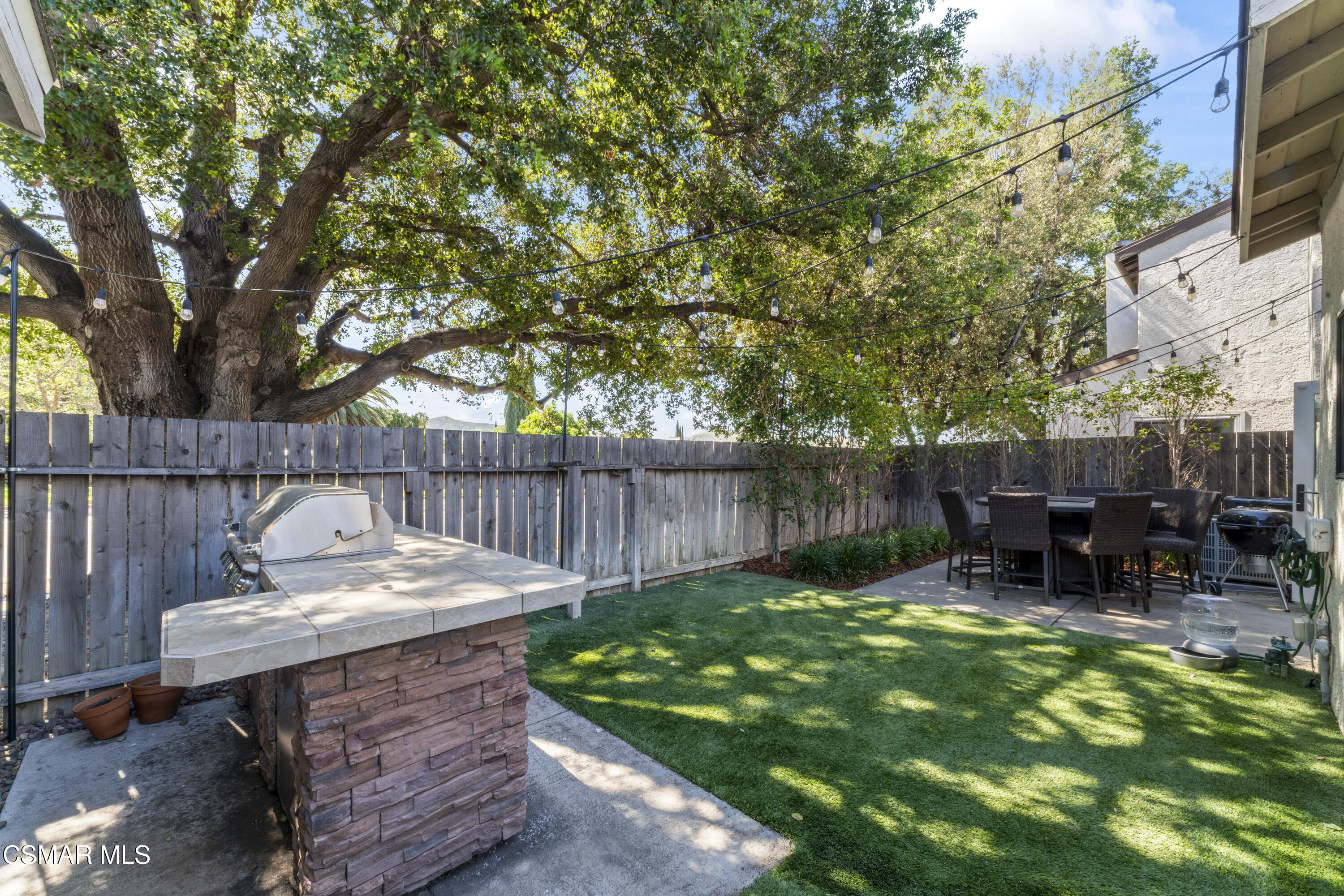 5775 Cochran Street Simi Valley, CA 93063 - Photo 28 of 33 a view of backyard with deck and outdoor seating