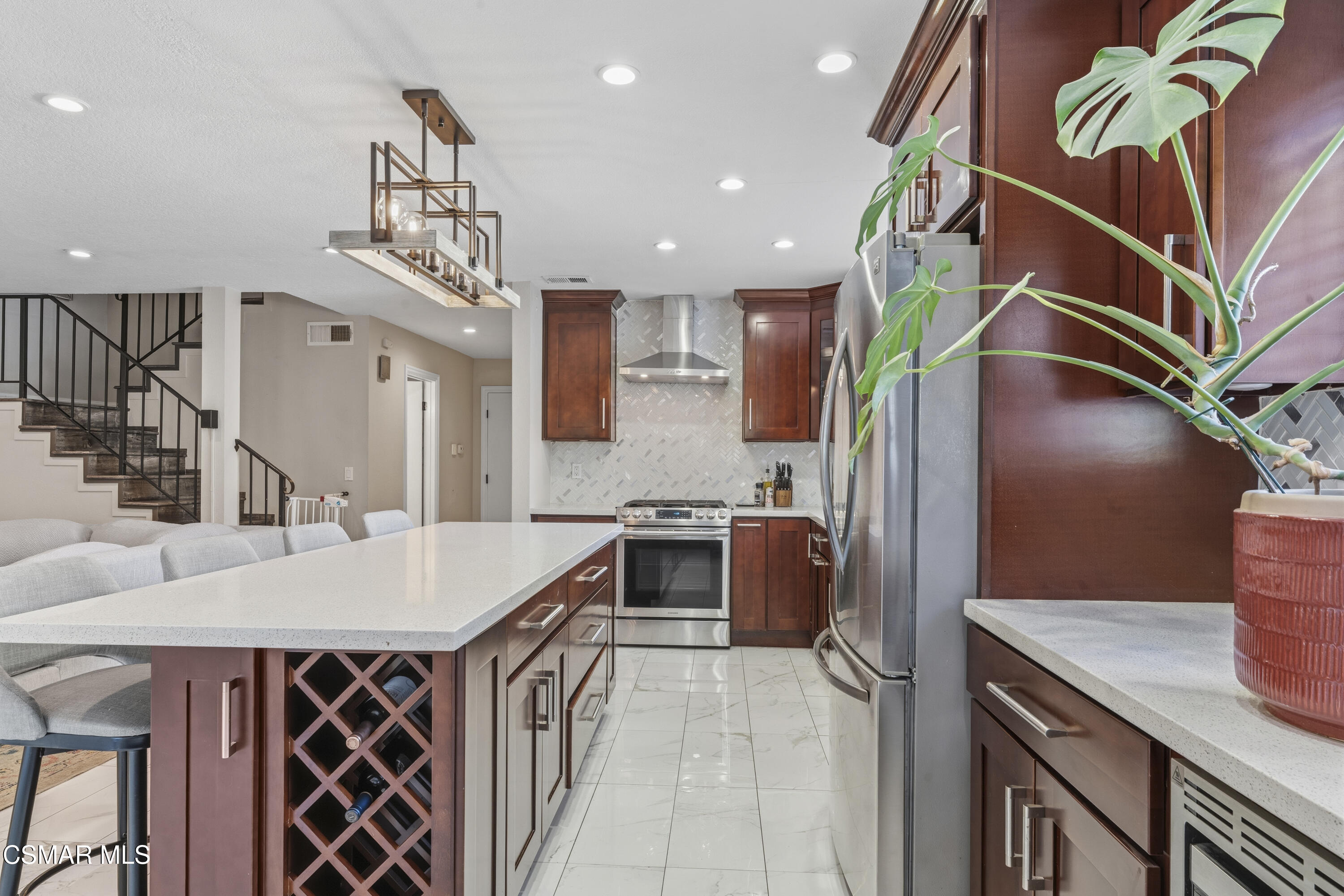 5775 Cochran Street Simi Valley, CA 93063 - Photo 3 of 33 a kitchen with stainless steel appliances granite countertop a sink and a refrigerator