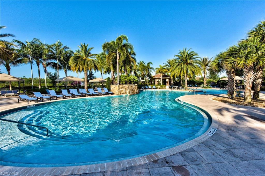 3424 Atlantic Circle Naples, FL 34119 - Photo 11 of 14 a view of a swimming pool with a patio