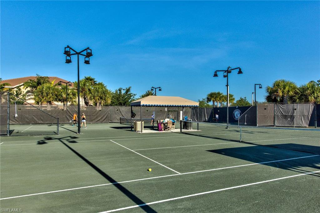 3424 Atlantic Circle Naples, FL 34119 - Photo 14 of 14 a view of a tennis court