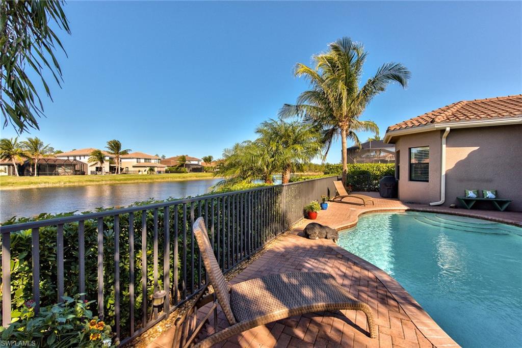 3424 Atlantic Circle Naples, FL 34119 - Photo 5 of 14 a view of a swimming pool with a patio