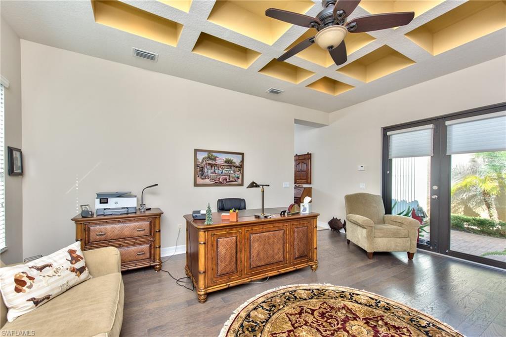 3424 Atlantic Circle Naples, FL 34119 - Photo 8 of 14 a bedroom with furniture and a large window