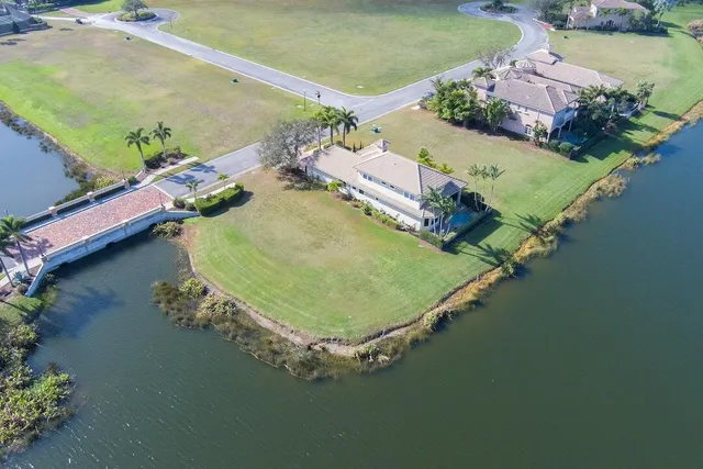 an aerial view of a house with a ocean view