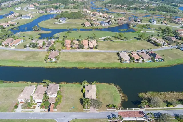 an aerial view of a house with a lake view