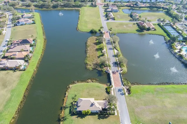 an aerial view of a house a yard basket ball court