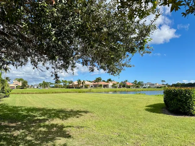 a view of a ocean with houses in the back