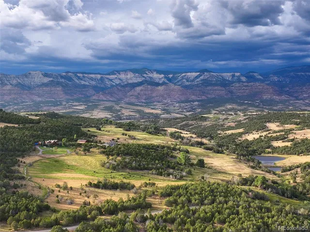 a view of a lake with mountains in the background
