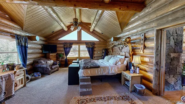 a bedroom with furniture and a window