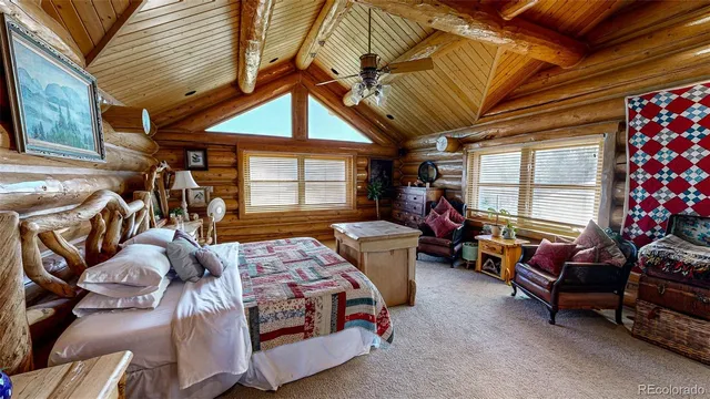 a bedroom with furniture and a chandelier