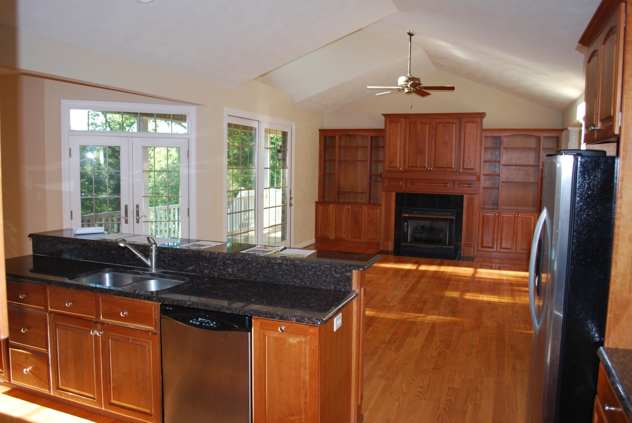 1088 Loggers Road Goodview, VA 24095 - Photo 14 of 22 a kitchen with granite countertop a sink and a refrigerator
